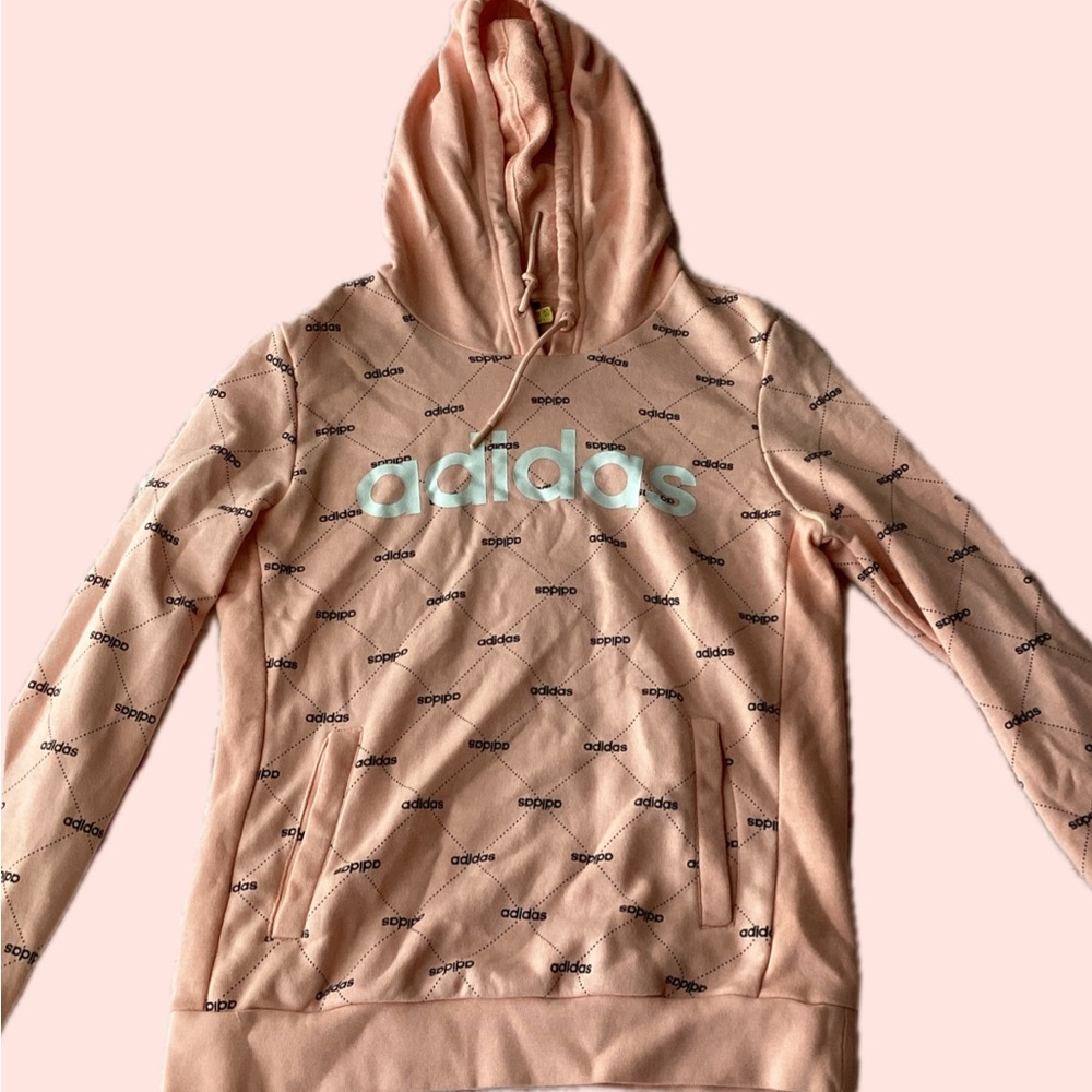 Soft Pink Hooded Sweater with Subtle Text